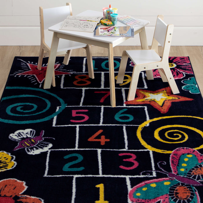 Technicolor Hopscotch Black Area Rug
