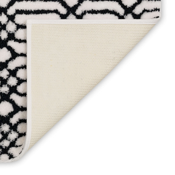 Lewis White and Black Bath Mat Covered By Rugs